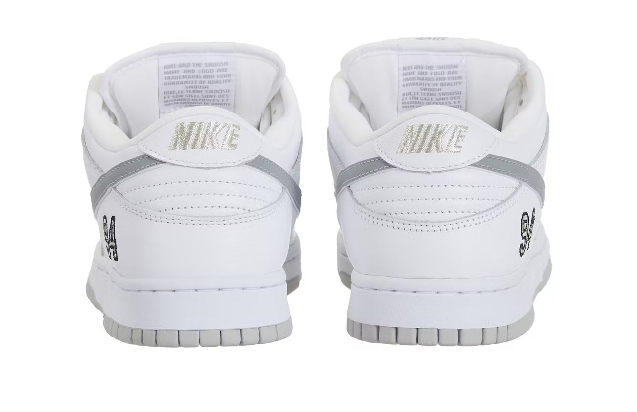 SB DUNK LOW SUPREME 94 WHITE METALLIC